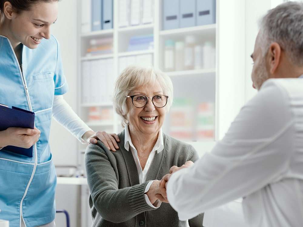 patient shaking hands with doctor.