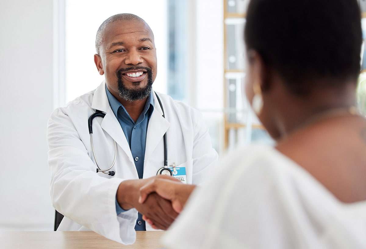 male doctor consulting with a patient.