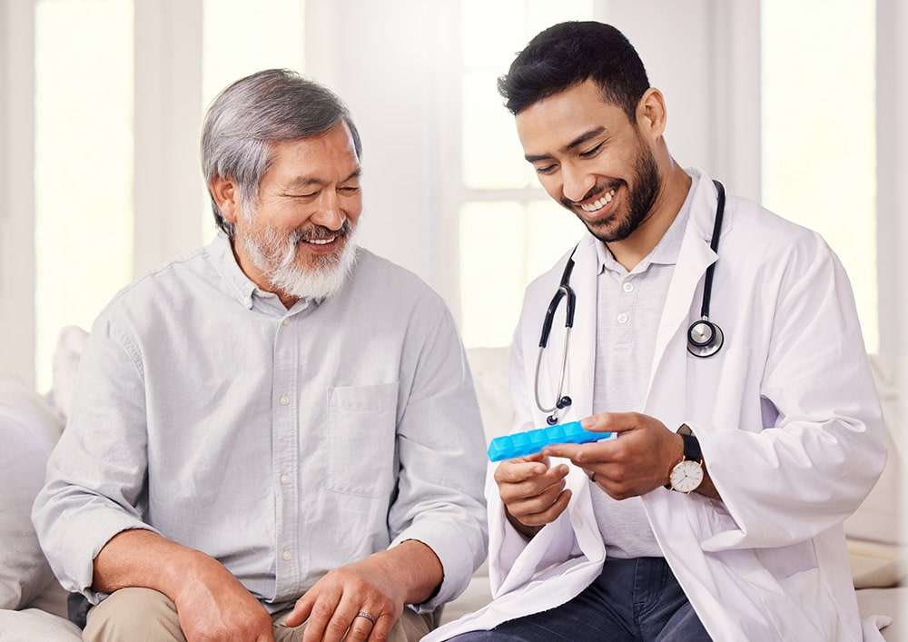 male doctor consulting with an elderly patient.